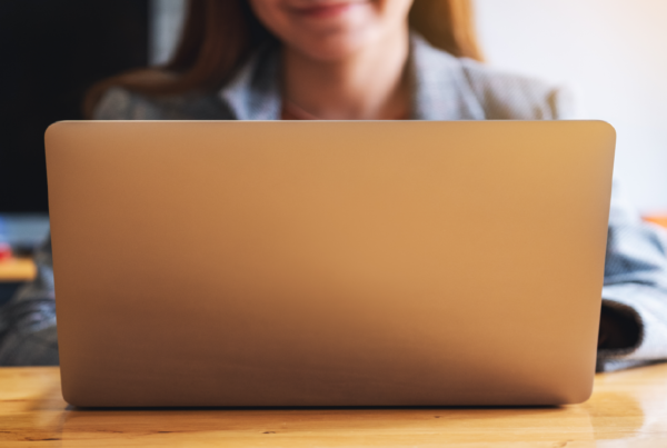 businesswoman-doing-bank-reconciliation-on-laptop